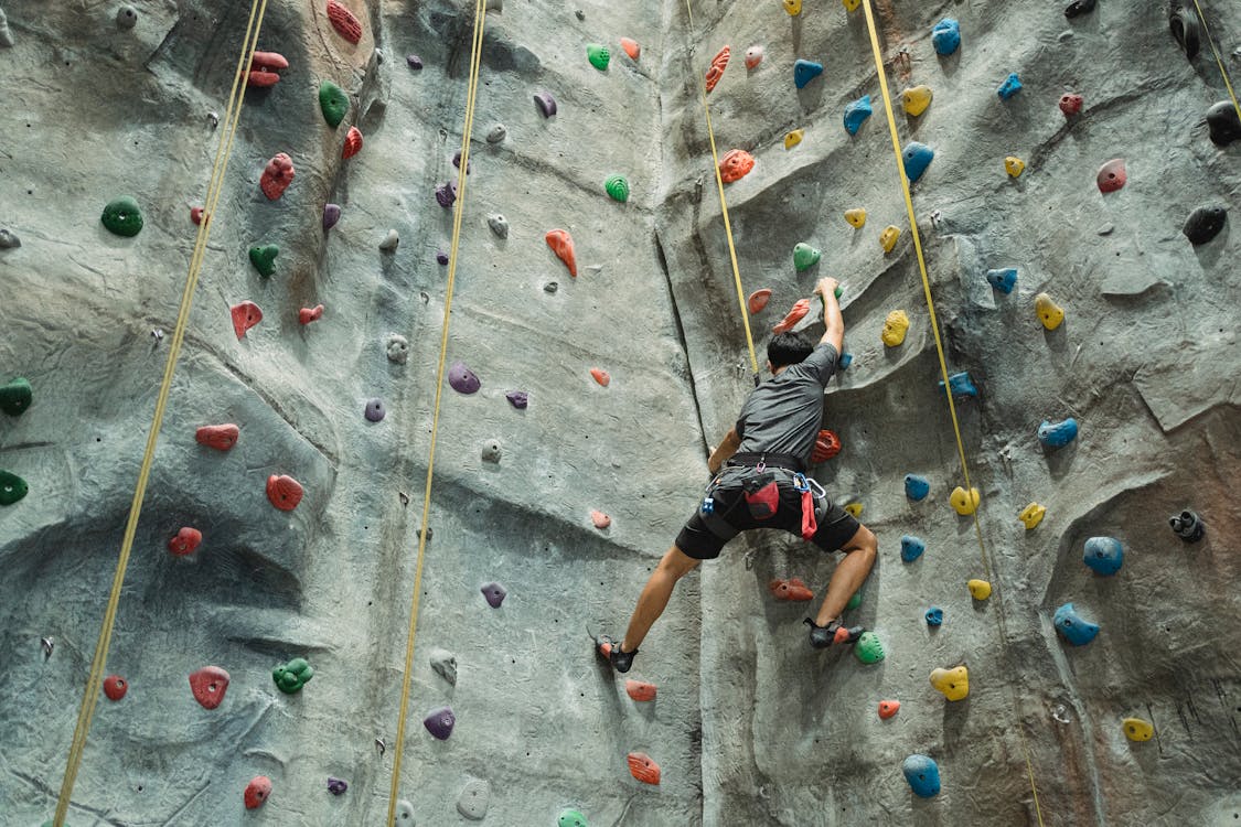 Bouldering: Men Scaling New Heights with Determination